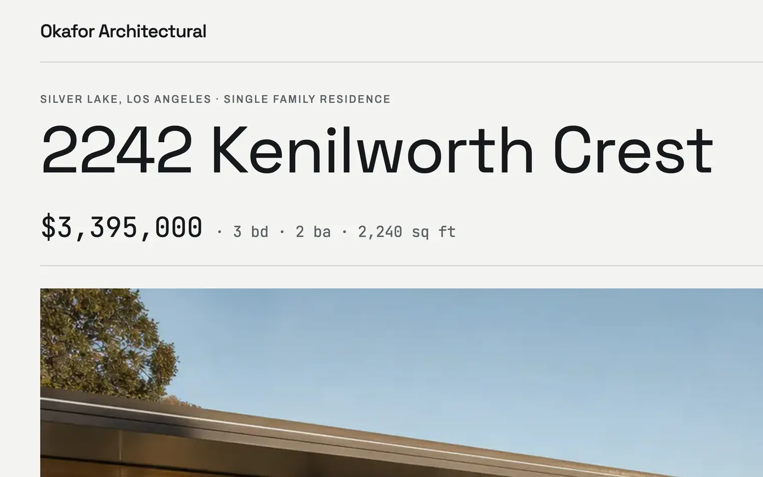 The 2242 Kenilworth Crest listing page on the Okafor Architectural sample site: the address in condensed sans over the price and specification line in monospace, and beneath it the page’s own photograph — the glass house cantilevered over the reservoir.